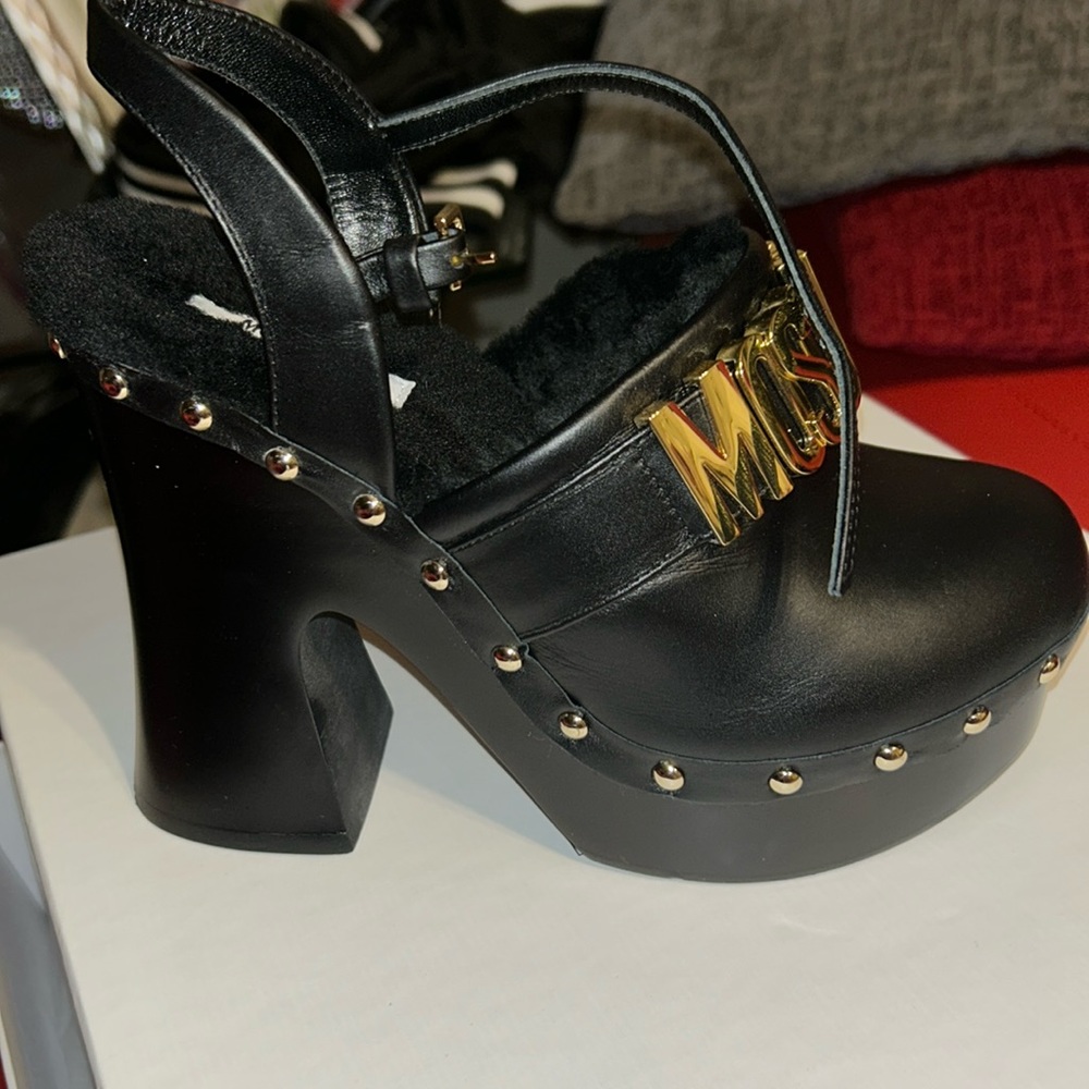 Moschino clogs  very beautiful wore once .